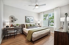 Orlando apartment for rent - a bedroom with a bed and a ceiling fan
