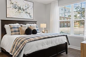 Midlothian apartment for rent - a bedroom with a bed and two windows