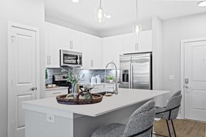 Midlothian apartment for rent - a kitchen with white cabinets and a white counter top