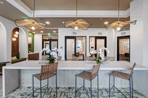 Orlando apartment for rent - A dining area with a long table and chairs.