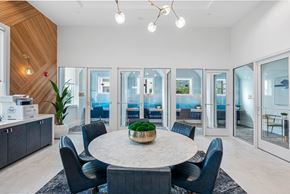 Wesley Chapel apartment for rent - A modern dining room with a round table and chairs.
