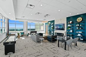 Orlando apartment for rent - a living room with a table and chairs and a television
