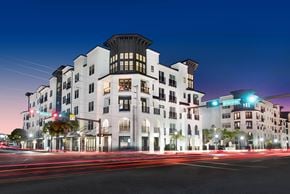 Sarasota apartment for rent - a rendering of an apartment building at night with traffic lights