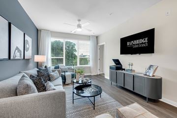 Clarksburg apartment for rent - A living room with a grey couch and a coffee table.
