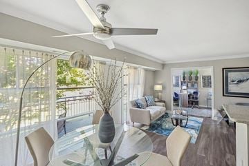 Annapolis apartment for rent - A modern living room with a glass dining table and chairs.