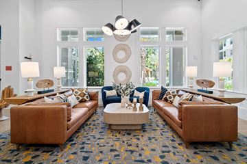 Ponte Vedra apartment for rent - A living room with brown leather couches and a large rug.