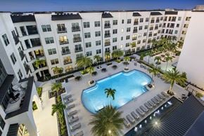 Sarasota apartment for rent - an overhead view of an apartment building with a swimming pool