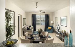 Naples apartment for rent - a living room with a table and chairs and a couch