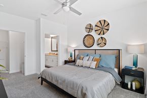 Clermont apartment for rent - a bedroom with a bed and a ceiling fan