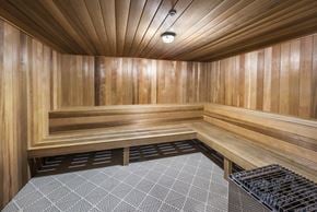 Sarasota apartment for rent - a sauna in a home gym with wood walls and flooring