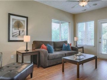 Fayetteville apartment for rent - a living room with a couch and tables