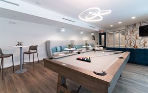 Concord apartment for rent - A room with a pool table and a TV mounted on the wall.