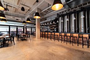 Kannapolis apartment for rent - the bar and dining area of a restaurant with tables and chairs