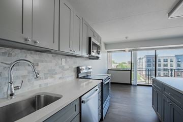 Rahway apartment for rent - A modern kitchen with a stainless steel sink and dishwasher.
