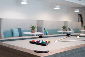 Concord apartment for rent - a pool table in a room with billiard balls on it at Novi Rise, Concord North Carolina
