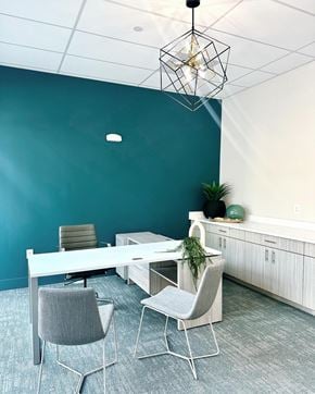 Concord apartment for rent - a conference room with a blue wall and a white table and chairs at Novi Rise, North Carolina