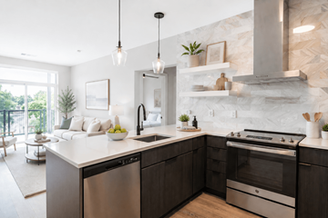 Kannapolis apartment for rent - A modern kitchen with dark wood cabinets and stainless steel appliances.