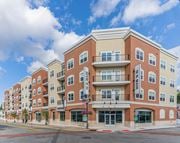 Wharton apartment for rent - A large apartment building with a balcony on the second floor at 10 N. Main Apartments, Wharton, New Jersey