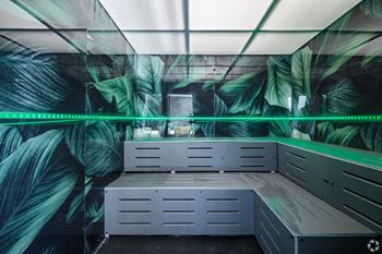 A sauna with a green light strip