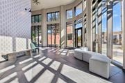 Hackensack apartment for rent - A sunny day at the modern building with a lot of windows and a fan.
