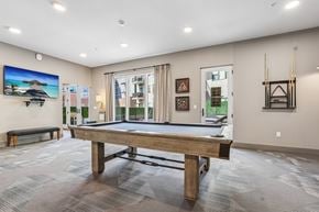 Hackensack apartment for rent - A room with a pool table and a bench.