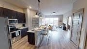 Hackensack apartment for rent - A kitchen with a dining table and chairs at Crossroads 389 Apartments, Hackensack