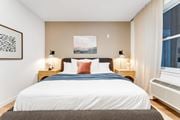 East Orange apartment for rent - A Bedroom With a Large Bed at Hue Soul Apartments, East Orange, NJ, 07018
