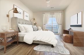 Belmar apartment for rent - A bedroom with a large bed and a window with curtains.