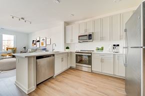 Belmar apartment for rent - A kitchen with white cabinets and stainless steel appliances.