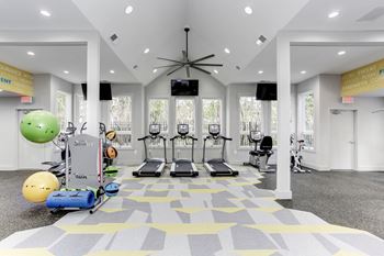 24-Hr. Fitness center with cardio machines and free weights 