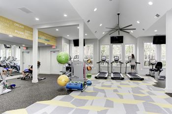24-Hr. Fitness center with cardio machines and free weights 