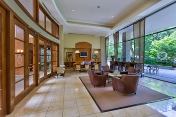 24-Hour business center with mac computers and work from home seating areas 
