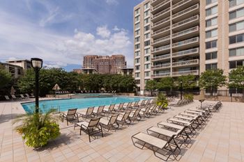 Olympic-sized pool with swimming lanes, free swim area, and expansive sundeck with chaise lounge chairs 