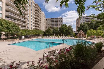Olympic-sized pool with swimming lanes, free swim area, and expansive sundeck with chaise lounge chairs 