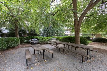 Grand apartment community with sprawling central courtyard connecting two apartment towers and ample amenities 