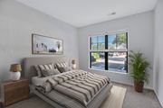 Lorton apartment for rent - A bedroom with a large bed and a painting on the wall.
