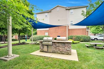 Grilling area with two gas grills and seating