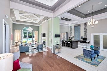 Annapolis apartment for rent - a living room with couches and chairs and a piano