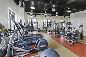 24-Hour fitness center with cardio and free weights