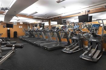 24-Hr. Fitness center with cardio machines and free weights 