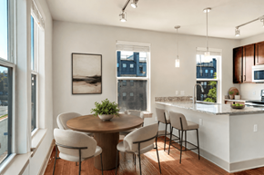 Herndon apartment for rent - A modern kitchen with a dining table and chairs.
