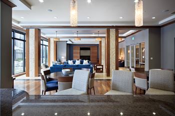Elaborate clubroom equipped with full kitchen, bar, billiards table and more