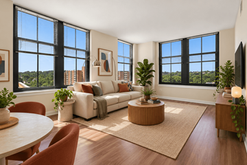 Arlington apartment for rent - A living room with a white couch and a large window.
