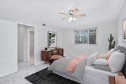 Arlington apartment for rent - a bedroom with white walls and a white ceiling fan