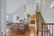 Lorton apartment for rent - A dining room with a wooden table and chairs.