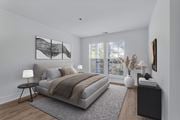 Arlington apartment for rent - A bedroom with a large bed, a nightstand, and a window with blinds.