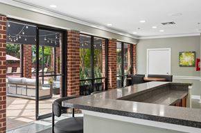 Woodbridge apartment for rent - A kitchen with a black counter top and a white door.