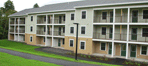 Bristol apartment for rent - Apartment building with green doors and windows.