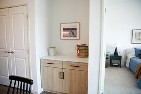 Minnetrista apartment for rent - a living room with a counter and a bedroom with a bed