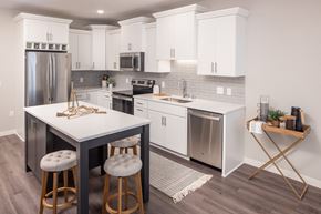 Tonka Bay townhouse for rent - Kitchen with large island and white cabinets